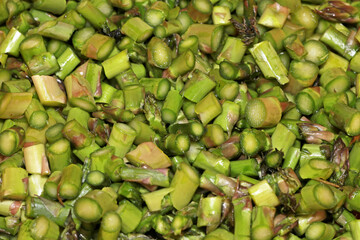 Close up shot of freshly chopped Asparagus  in to small pieces 