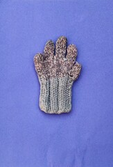 Baby glove in blue background