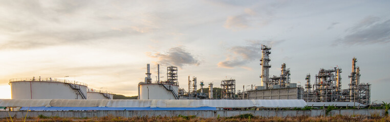 Industrial view of the refinery from the industrial zone in the time of sunrise and cloudy sky in Thailand.
