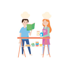 young couple reading recipes book and preparing food in the kitchen, activity indoor