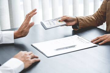 Businessman partner hand gesture rejecting refusing money, anticorruption concept.