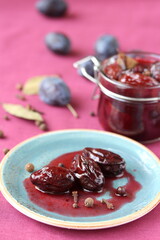 pickled plum with spices. spicy plum in its own juice.  The plum is cooked with a bite and spices for a long time, cooking many times. the juice is gradually discharged, and the sludge is dead.