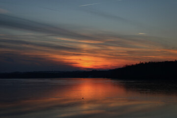 Naklejka na ściany i meble Sunset over a lake