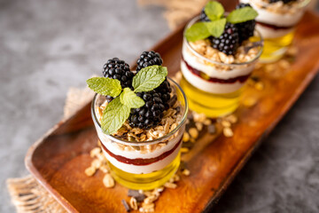 Dessert Parfait glass cup, with lemon jello, yogurt and fresh blackberries. 