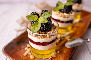 Dessert Parfait glass cup, with lemon jello, yogurt and fresh blackberries. 