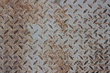 Rusty metal surface texture with jagged edges. Background