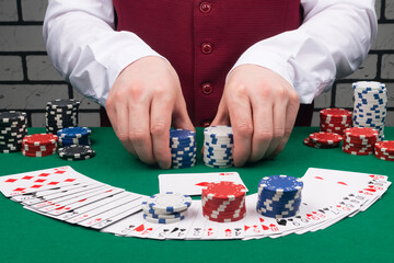 close-up, high-stakes card games, croupier's hands holding chips