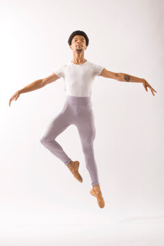 Young Black Male Ballet Dancer Showing His Skills In The Studio.