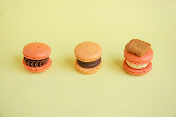 Top view of assortment colorful  korean macaroons on yellow background