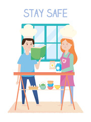 stay safe, smiling couple cooking in the home, during covid 19 quarantine