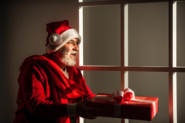 Its yours. New year is coming. happiness and joy. ready for xmas party. celebrate winter holiday. funny man wear santa claus coat and hat. shopping. Merry Christmas and Happy Holidays