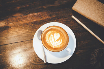 Top view of hot coffee cup cappuccino Latte art foam heart shape flower shop