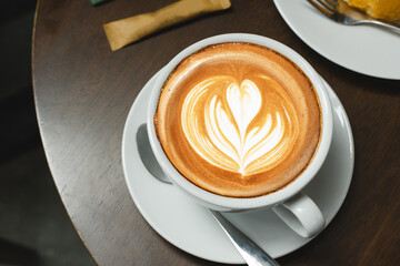 Top view of hot coffee cup cappuccino Latte art foam heart shape flower shop