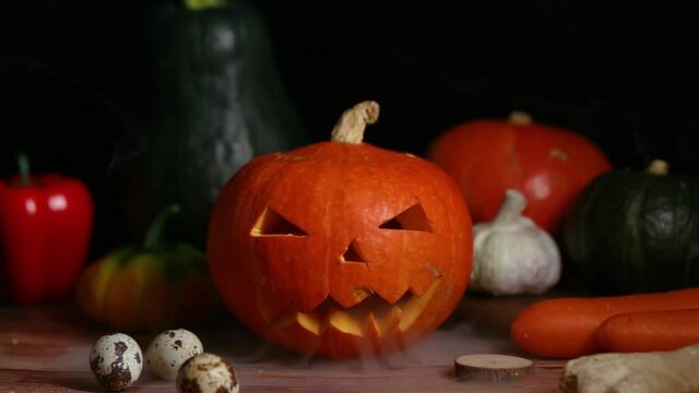 A jack-o '-lantern for Halloween is set against a black background