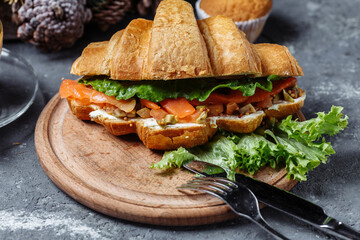 New Year's breakfast with croissants. New Year's croissant with red fish and avocado. New Year and Christmas concept