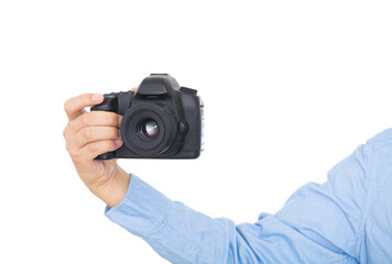 Hand holding black SLR camera close-up