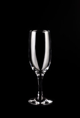 empty champagne glass on a black background.