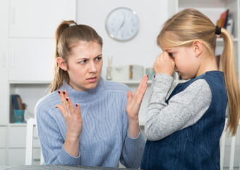 Mom scolds little daughter. Crisis of motherhood. High quality photo