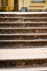 Cracks on old stone stairs.
