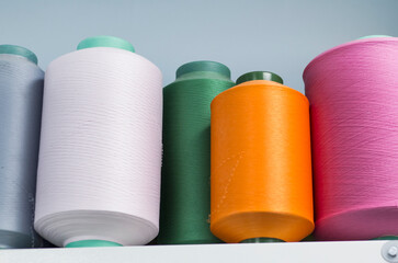 Rows of coils with threads of different colors in the knitting industry