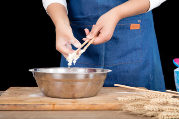 The chef is making noodles