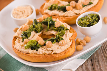 Friselle with turnip tops and hummus.