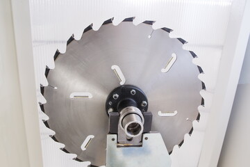 Circular saw of an automated machine. Woodworking industry concept.