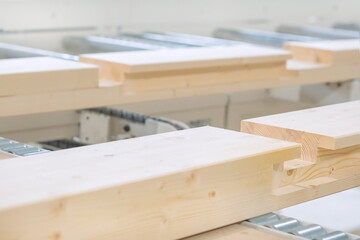 Wooden beam in sawn grooves. Woodworking machine products. Construction materials made of wood. Eco-friendly building materials.