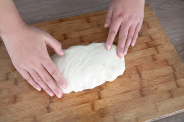 Put the prepared dough on the oiled cutting board