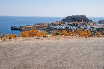 viewpoint in the parking bay overlooking the town of Lindos in Rhodes
