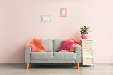 Stylish sofa in interior of living room