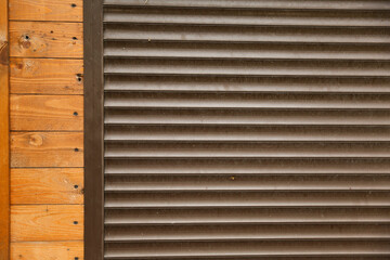 Obraz premium wall with brown roller shutters background