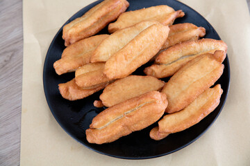 A plate of fried golden fried dough sticks