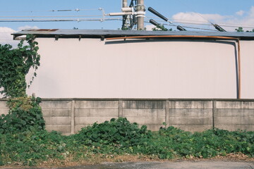 blank wall by the train tracks