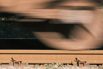 wheels of a train passing by over an old railway