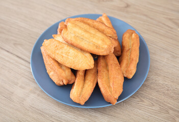 A plate of golden fried dough sticks