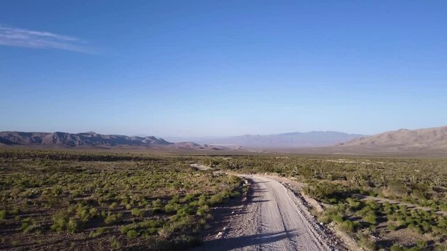 Aerial Drone Shot of Red Desert Mountains. Aerial view of empty Mojave desert landscape between Barstow and Baker in Southern California.