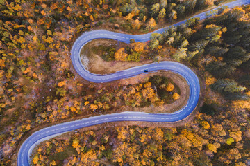 autumn, beautiful mountain road aerial landscape with fall season colors foliage, travel by car
