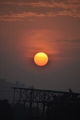 Obraz premium sunset over industrial area