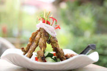Chicken Satay on dark brown table street food appetizer