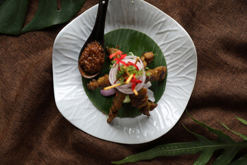 Chicken Satay on dark brown table street food appetizer