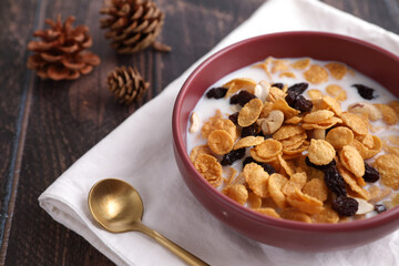 Cereal dessert with corn oat and dry fruits isolated in wood background