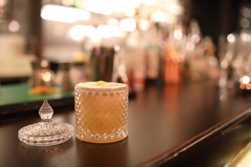 cocktails in glasses on bar counter in pup or restaurant