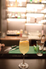 cocktails in glasses on bar counter in pup or restaurant