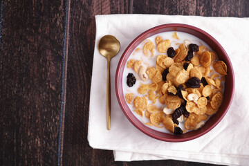 Cereal dessert with corn oat and dry fruits isolated in wood background