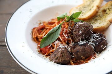 Spaghetti Meatballs on wood background
