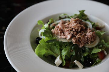 Tuna salad appetizer on wood background