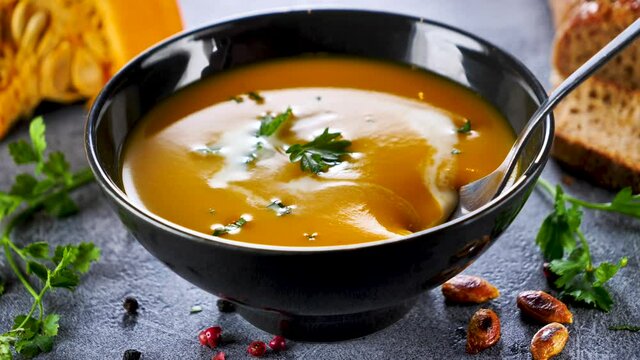pumpkin soup- eating with spoon- slow motion