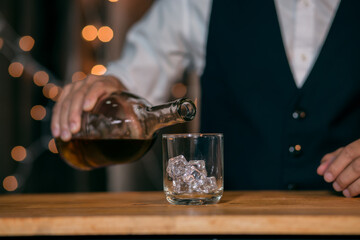 Barman pouring whiskey whiskey glass beautiful night