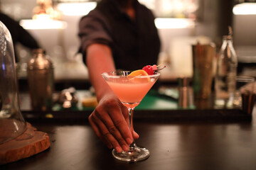 cocktails in glasses on bar counter in pup or restaurant